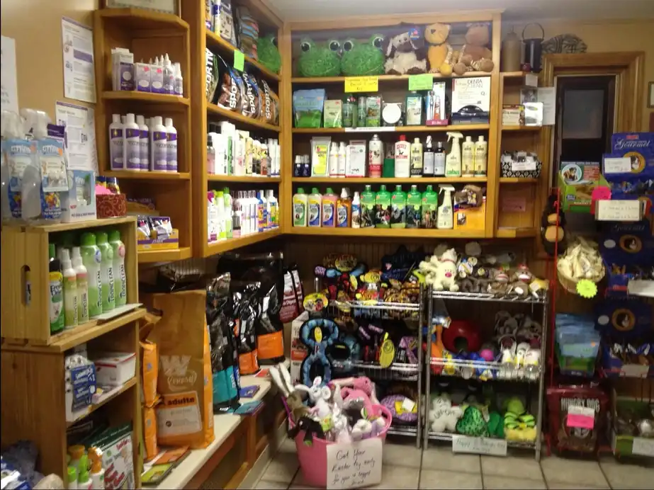 Shelves of pet food, treats, toys and grooming supplies in the Champion shop